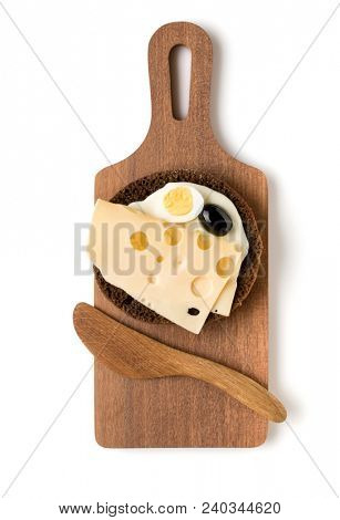 Open  faced cheese sandwich canape or crostini on a wooden serving board  isolated on white background closeup. Top view. Vegetarian tartarine.