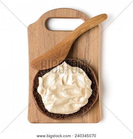 Open  faced hummus sandwich canape or crostini on a wooden serving board  isolated on white background closeup. Top view. Vegetarian tartarine.