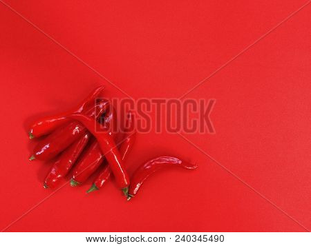 Cofred Hot Pepper On Red Plain Background