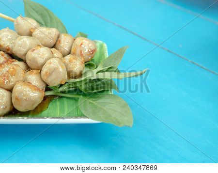 Griiled Pork Meatball With Spicy Sauce And Basil Leaf On The Table, Thai Appetizer