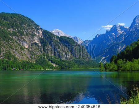 Grunau, Austria. Jun 15 2017: Mountains In The Background, Reflecting Over A Lake