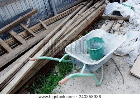 Image Of Old Used Dirty Wheelbarrow Outdoors