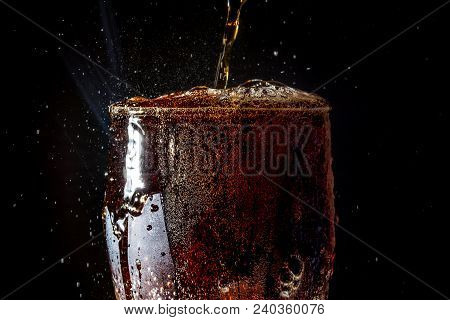 Soda Large Glass, Overflowing Glass Of Soda Closeup With Bubbles Isolated On Black Background