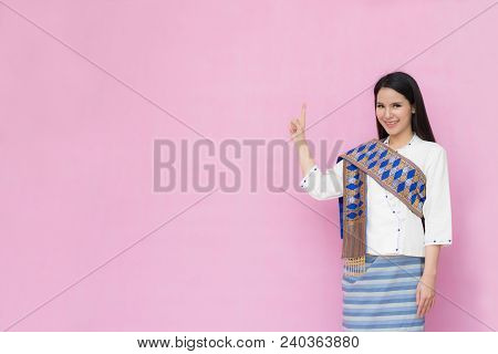 Portrait Beautiful Asian Girl In Traditional Thai Dress Isolated On Pink Background. .cotton Dress