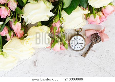 Pink And White Blooming Roses With Sceleton Key And Antique Clock