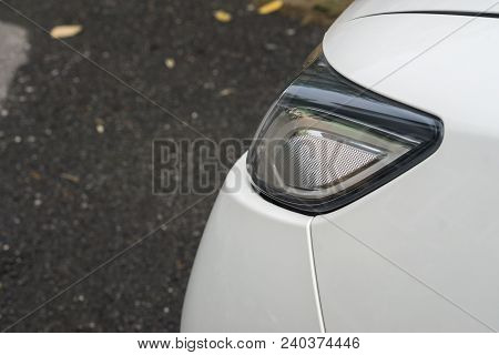 Headlight Of The Vehicle White Car In Rainyday.