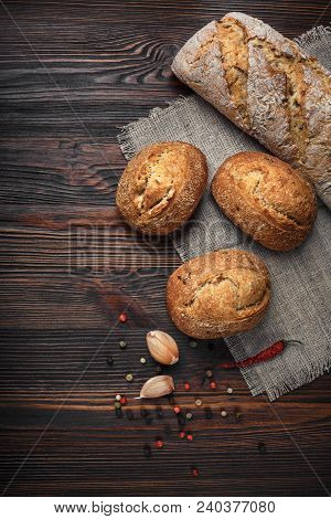 A Set Of Products From Bread Of Garlic Pepper On A Wooden Table