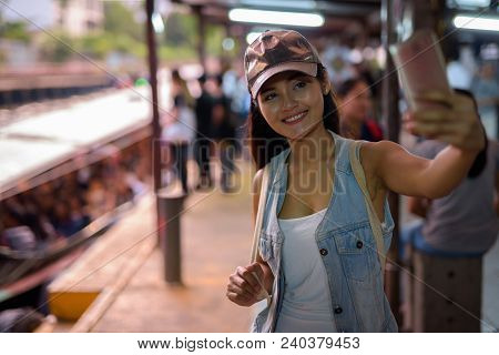 Portrait Of Young Beautiful Asian Tourist Woman Exploring The City Of Bangkok, Thailand