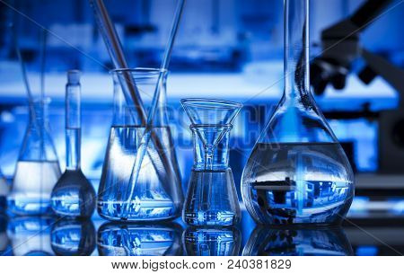 Science Concept Background. Chemical Experiment. Microscope, Glass Beakers And Test Tubes In Laborat
