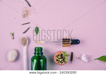 The Minimal Style. Natural Cosmetics, Handmade Skin And Body Care. A Green Bottle With Pipets And Pl