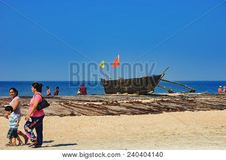 Goa, India - November 17, 2012: Unidentified Indian Tourists Walking Along The Cavelossim Beach At D