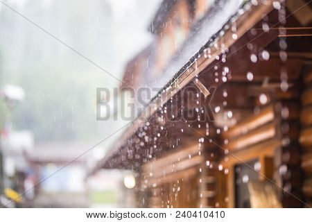 Downpour In The Summer Storm And Rain Drops On The Roof