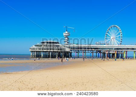 Scheveningen Pier With Fwrry Wheel At Beach, The Hague Netherlands