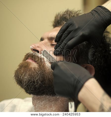 Hipster With Serious Face In Barbershop, New Technology. Haircut Of Bearded Man, Archaism. Fashion A