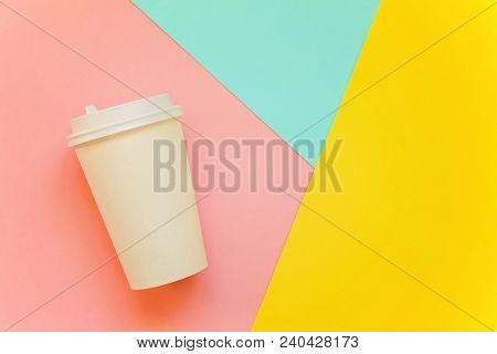 Paper Coffee Cup On Blue, Yellow And Pink Pastel Colorful Paper Geometric Flat Lay Background. Takea
