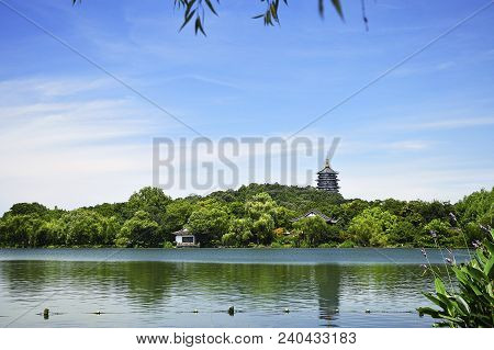 Hangzhou West Lake With Reflection Of Leifeng Pagoda In A Sunny Day. West Lake Is One Of The Famous 
