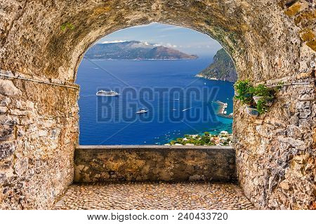 Scenic Rock Arch Balcony Overlooking The Beautiful Sorrento Peninsula From Capri, Bay Of Naples, Ita