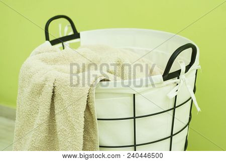 Laundry Basket On The Background Of The Washing Machine.