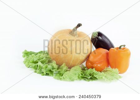 Pumpkin, Bell Pepper, Eggplant On Lettuce Leaves .isolated On White. Photo With Copy Space.