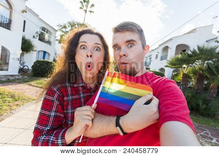 Amazing Homosexual Promote Their Relationship. Holding Gay Flag