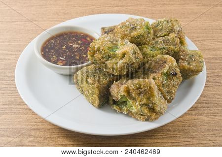 Plate Of Fried Chinese Pancake Or Fried Steamed Dumpling Made Of Garlic Chives, Rice Flour And Tapio