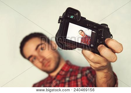 Self Portrait Of Cheerful, Bearded Blogger In Shirt Shooting Selfie, Making Video For His Blog Over 