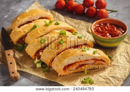Ham And Cheese Stromboli, Italian Cuisine, On Grey Background.