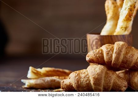 Delicious Breadsticks Grissini On Wooden Dark Background In Wooden Oldstyle Cup, Close-up, Selective