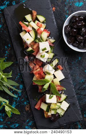 Greek salad with feta cheese cubes and fresk vegetables