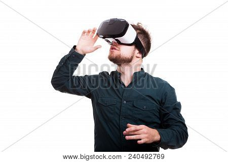 Young Man Experiencing Virtual Reality For The Firts Time. Isolated Over White Background. Studio Ph