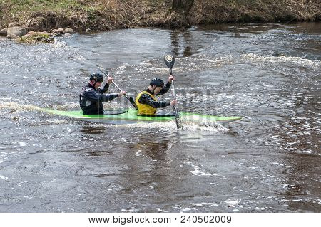 Grodno, Belarus - April, 2018: Kayak Freestyle Competition On Fast Cold Water River Strenuously Rowi