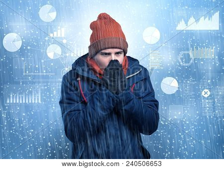 Young businessman shivering with graphs, reports and chart concept