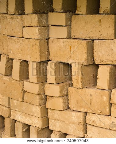 Stack Of Raw Bricks Drying In The Open Air.