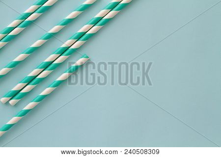 Group Of Cardboard Tubes For Cocktails With Blue Striped Straws On A Skyey Table. Selected Focus. To