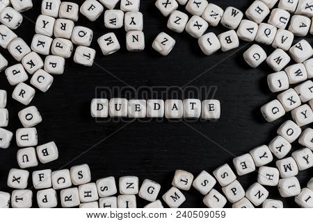 Word Duedate On Wooden Cubes On A Black Wooden Table With Copy Space