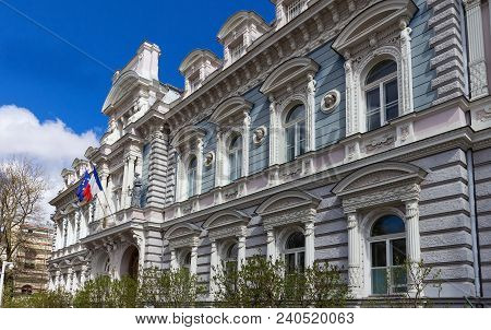 Riga, Latvia. Embassy Of France In Latvia. Facade Of Building Under Blue Clear Sky At Sunny Spring D