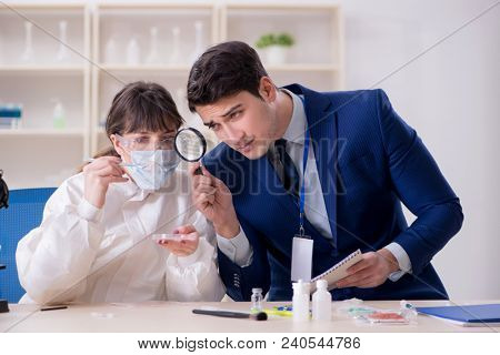 Expert criminologist working in the lab for evidence
