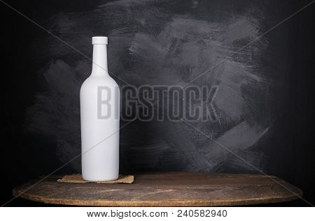 Wine Bottle Mock-up. Red Wine Bottle On Wooden Background