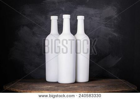 Wine Bottle Mock-up. Red Wine Bottle On Wooden Background