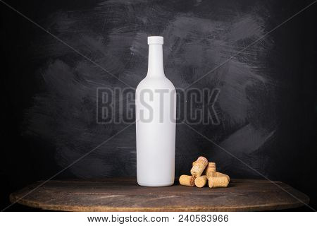 Wine Bottle Mock-up. Red Wine Bottle On Wooden Background