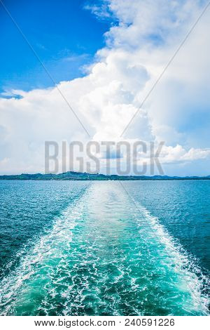 Ship Is Moving On The Sea Leaving Behind A Water Trace
