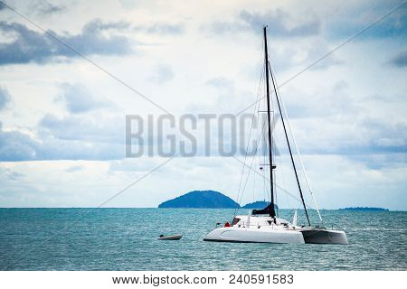 Yacht Drifting In The Ocean Bay At Summer