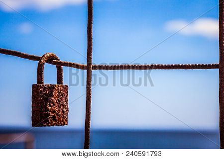 Lock Hanging On A Fence In The Name Of Love