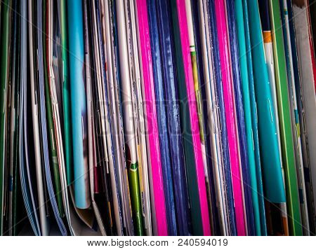 The Colorful Bindings Of The Books Standing On The Shelf