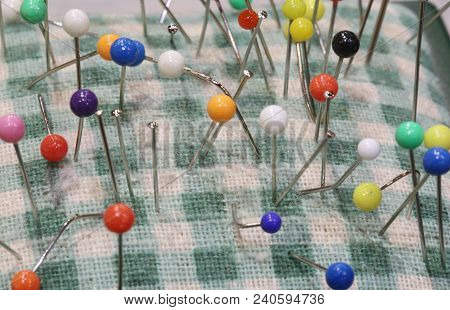 Colored Pins For Sewing Stuck On A Pincushion In A Haberdashery