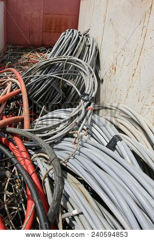 Many Unusable Electrical Cables Made With Rubber And Copper Into A Container In The Waste Disposal S