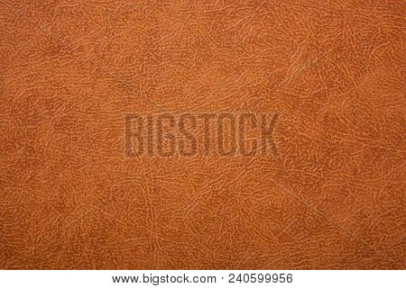 Brown Or Orange Textured Leather Background. Abstract Leather Texture