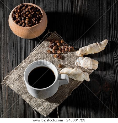 a cup of americano coffee on wood texture, still llife photography
