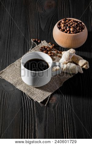 a cup of americano coffee on wood texture, still llife photography