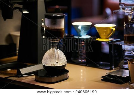 Coffee Maker Machine And Glassware In Coffee Shop With Cafe Bar On Background. Professional Coffee M